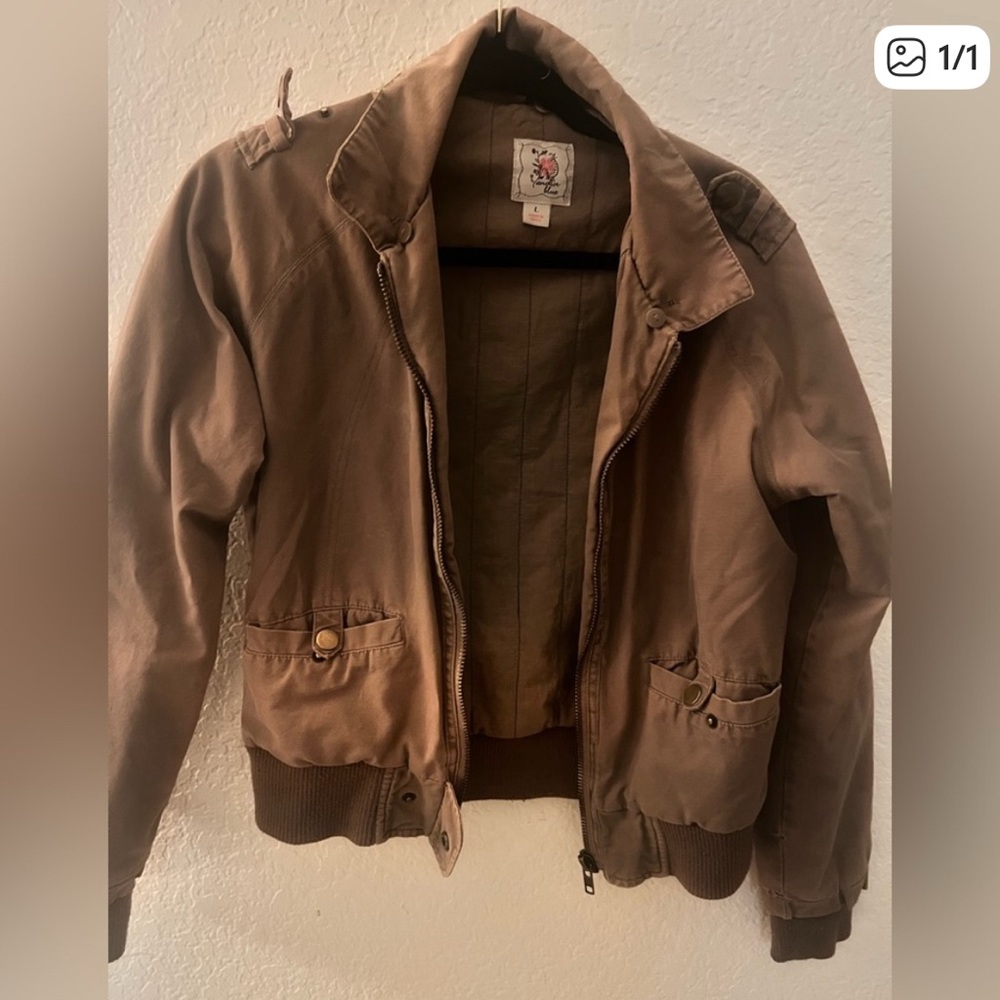 Woman’s brown jacket vintage distressed